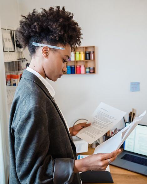 An analyst reading through a transcript at her desk