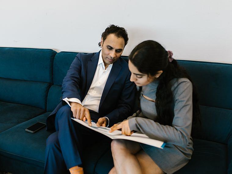Two colleagues in India working through a client question together
