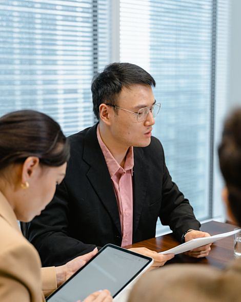 A team in a Singapore office working through a client brief